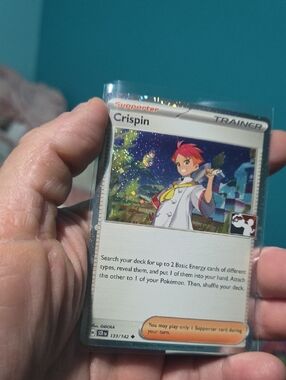 Pokemon Trainer Crispin Holographic Card - Blue, White, Red, Yellow